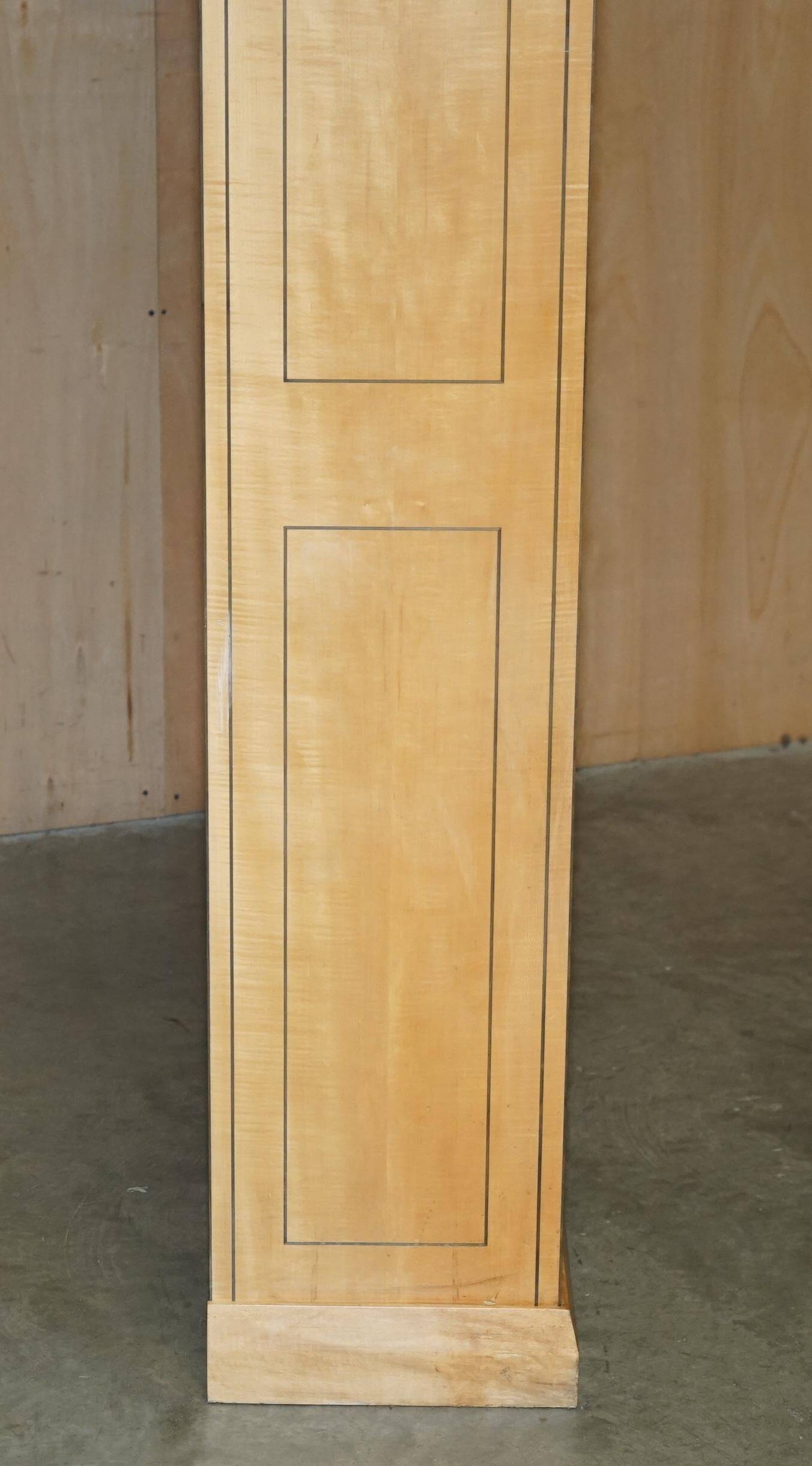 Pair of large open bookshelves in satin birch and walnut, height 2.5 m.
