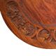 Circular tripod coffee table in carved wood