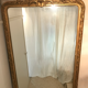 Large antique mirror with flagship shell in wood and gilded stucco
