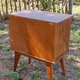 Wooden bedside table with compass feet