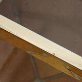 Gold metal and smoked glass console table.