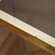 Gold metal and smoked glass console table.