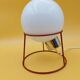 Red metal lamp with opaline globe from the 70s and 80s.