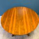 Expandable round table with butterfly extension