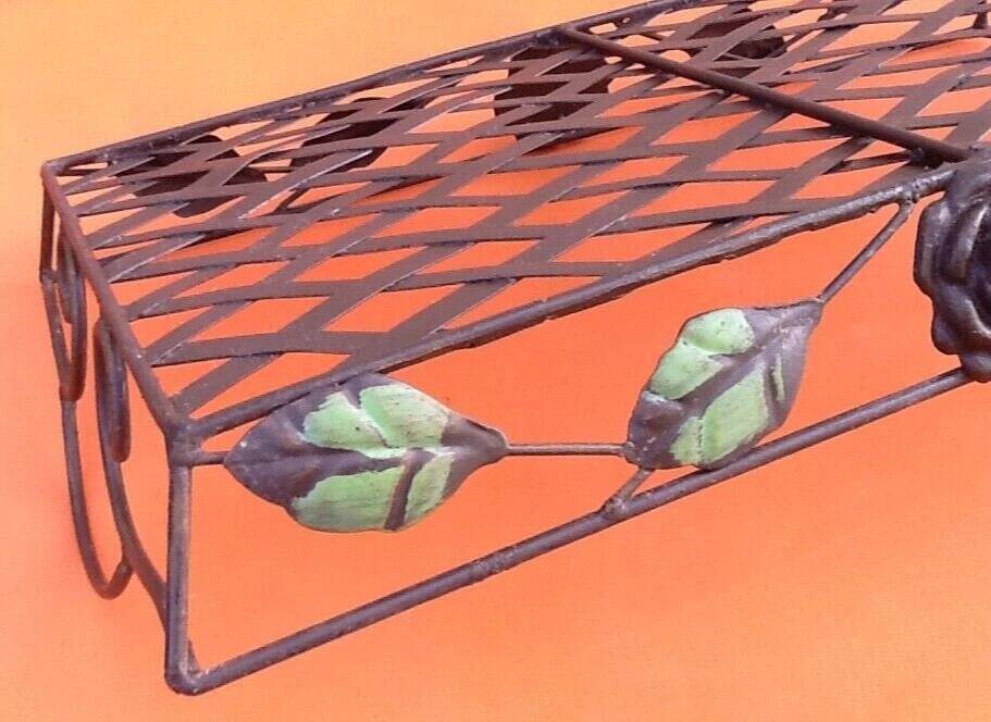 Rectangular metal serving tray with floral decoration.