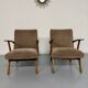 Set of 2 vintage wooden and fabric armchairs designed in the 1960s.