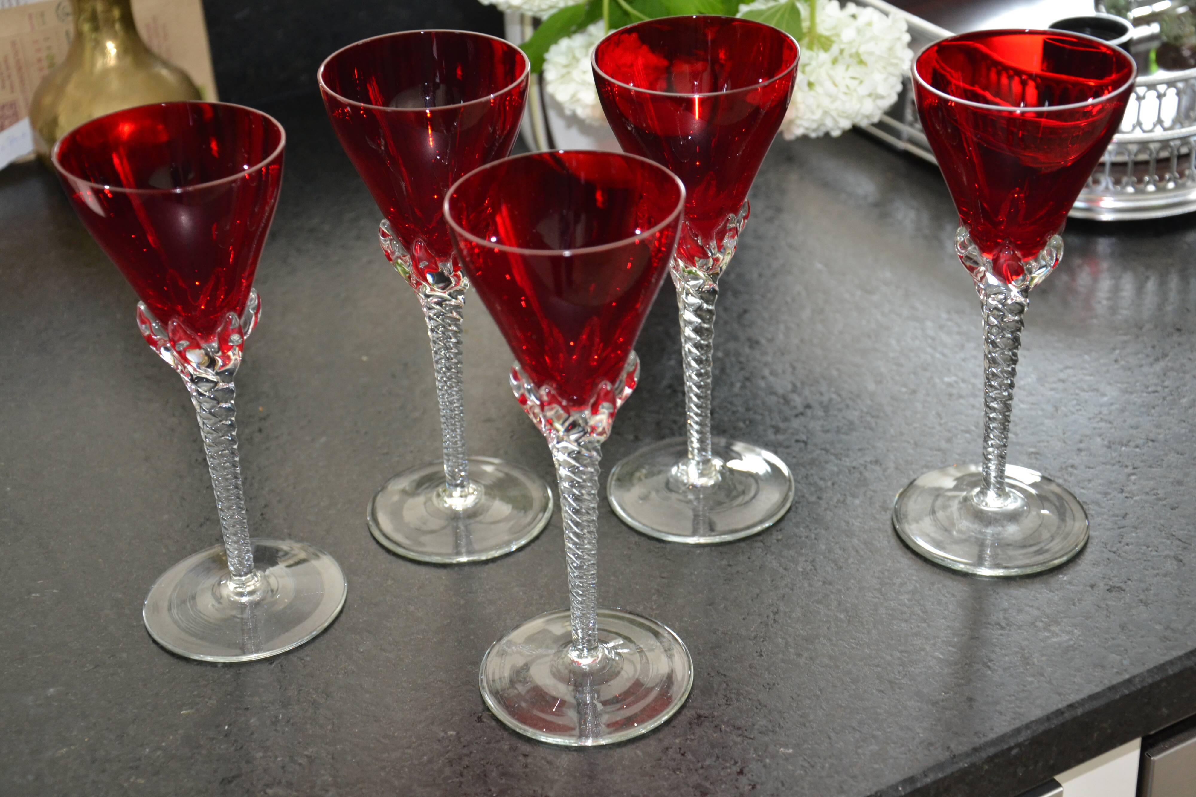 5 red crystal glasses with twisted stems