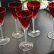 5 red crystal glasses with twisted stems
