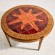 Coffee table in walnut with a ceramic top.