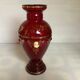 Cameo vase and red cabochons in burgundy glass