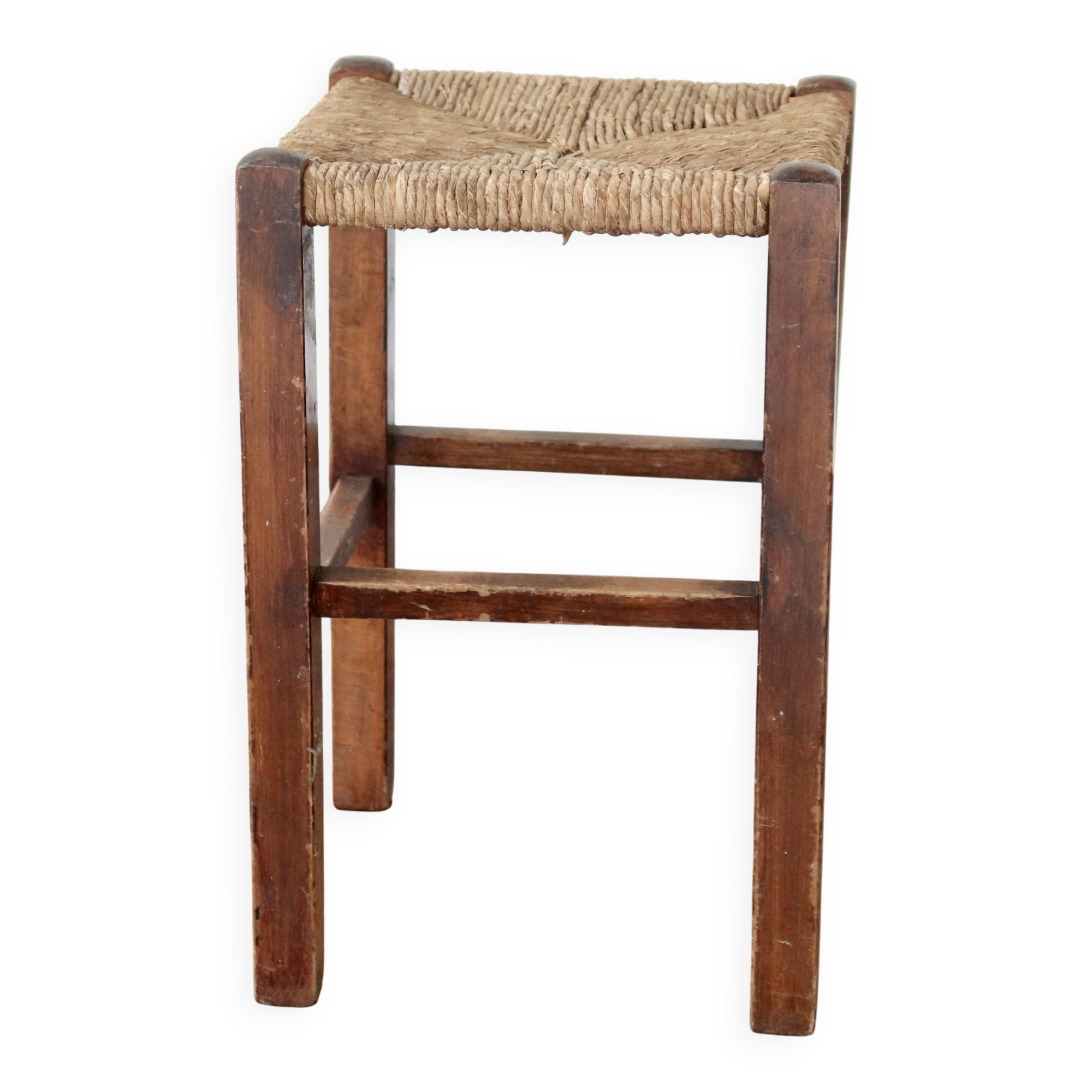 Rustic old stool made of wood and straw.