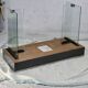 Modernist console, 1960s, glass base, wooden and fabric top.