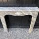 Louis XV fireplace in grey Ardennes marble, a floral basket in white marble, late 18th century.