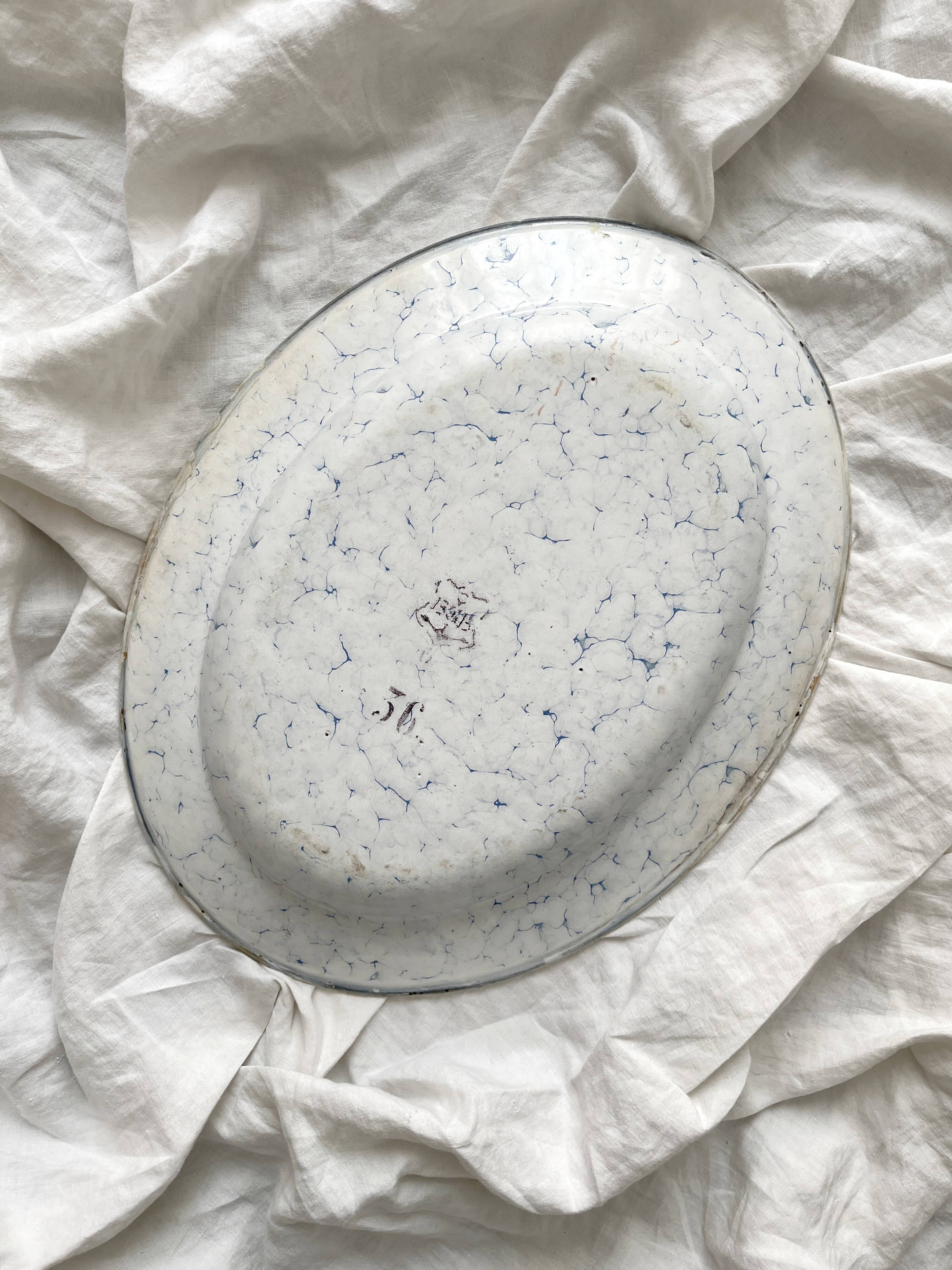 Vintage marbled white and blue enameled sheet metal oval dish