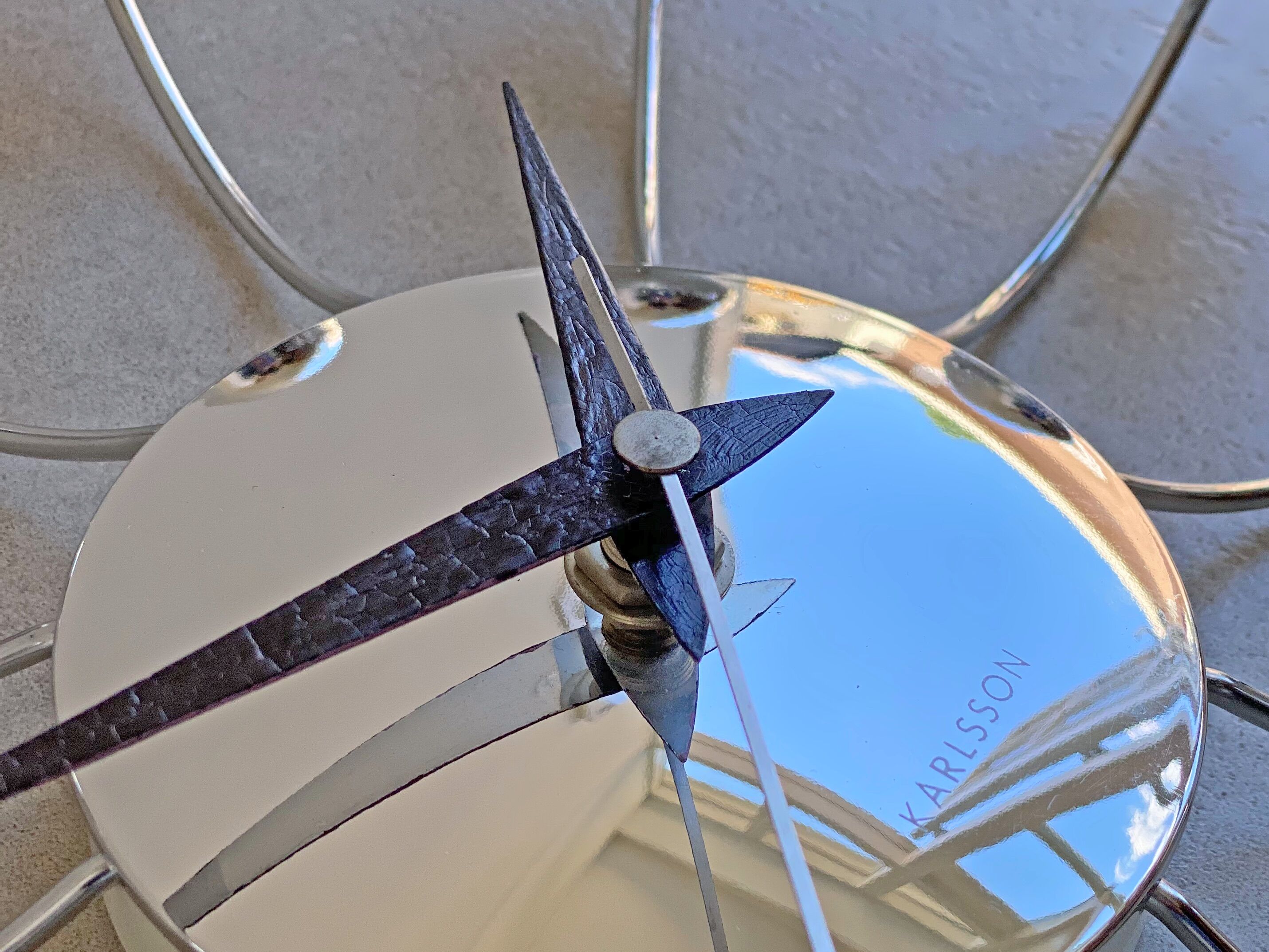 Chrome Karlsson spider wall clock with black hands, sputnik space age