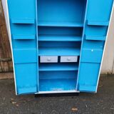 Old industrial metal cabinet in white and blue.