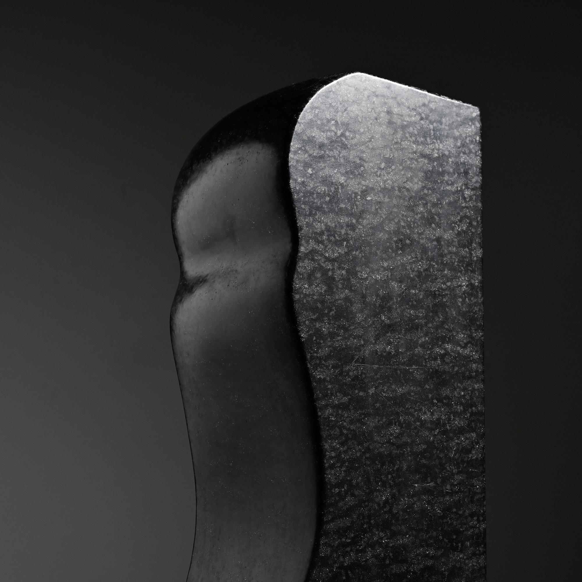 Abstract sculpture in diabase by Robert Neuhauser, Switzerland, circa 1985.