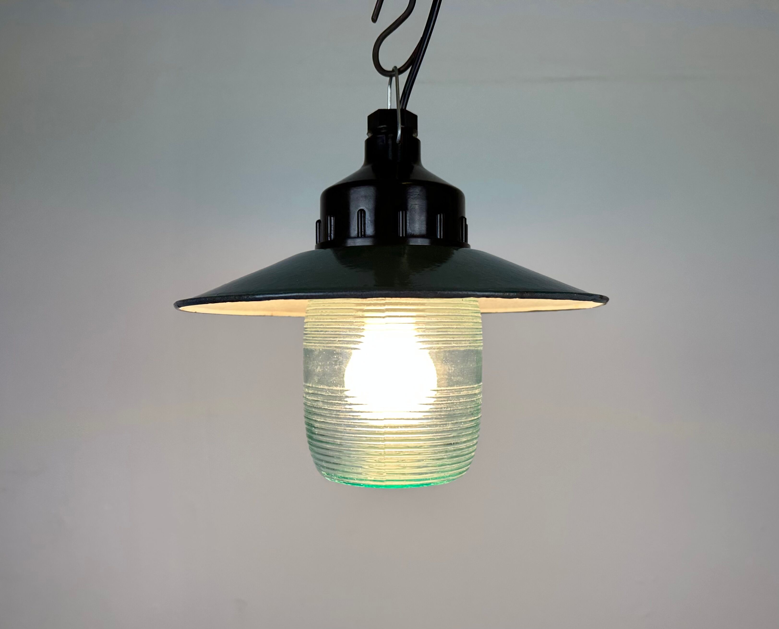 Industrial bakelite green enamel pendant light with ribbed glass, 1970s