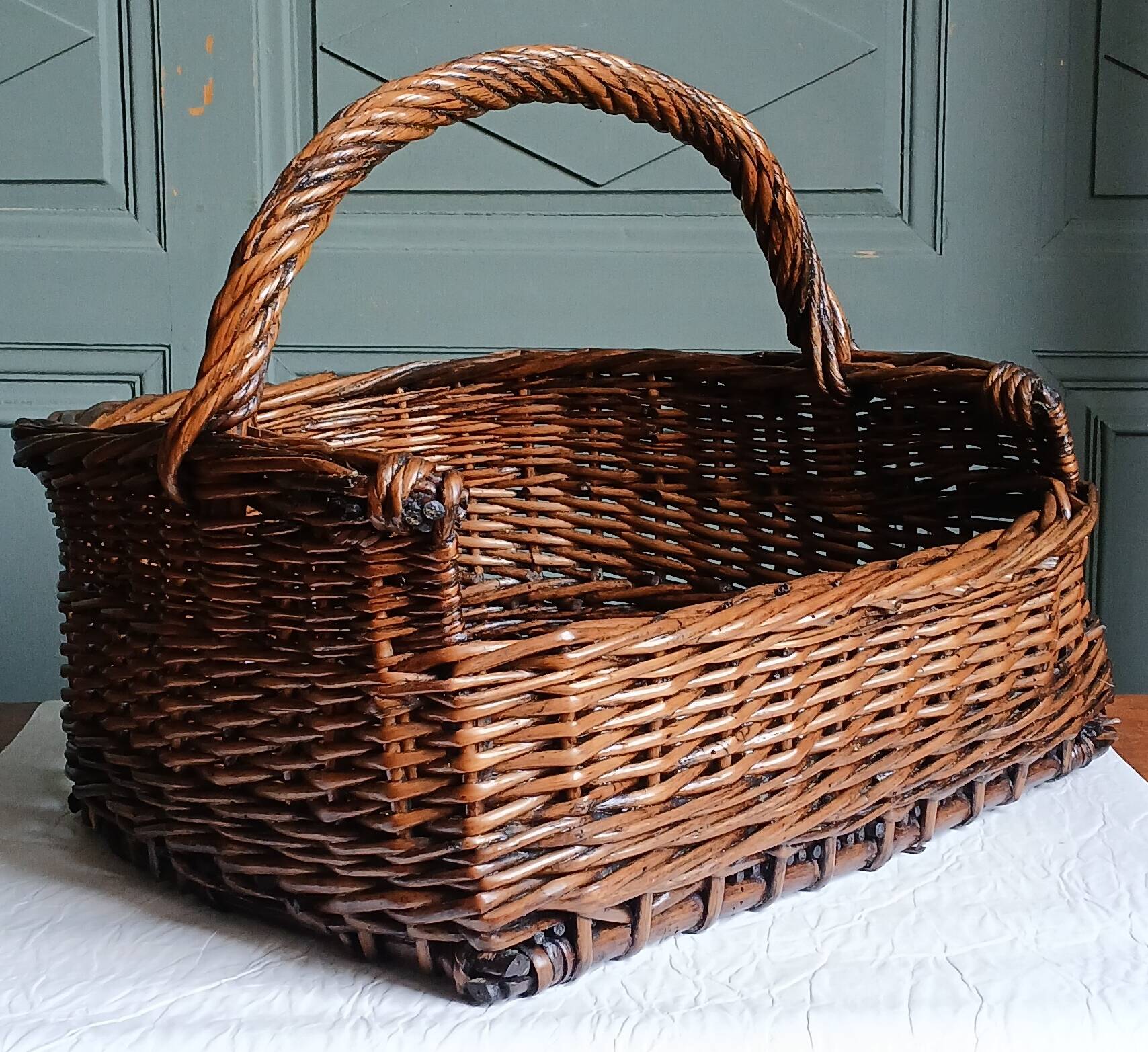 Handmade woven and dyed willow harvest basket.