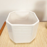 White vintage pot cover with stripes