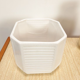White vintage pot cover with stripes