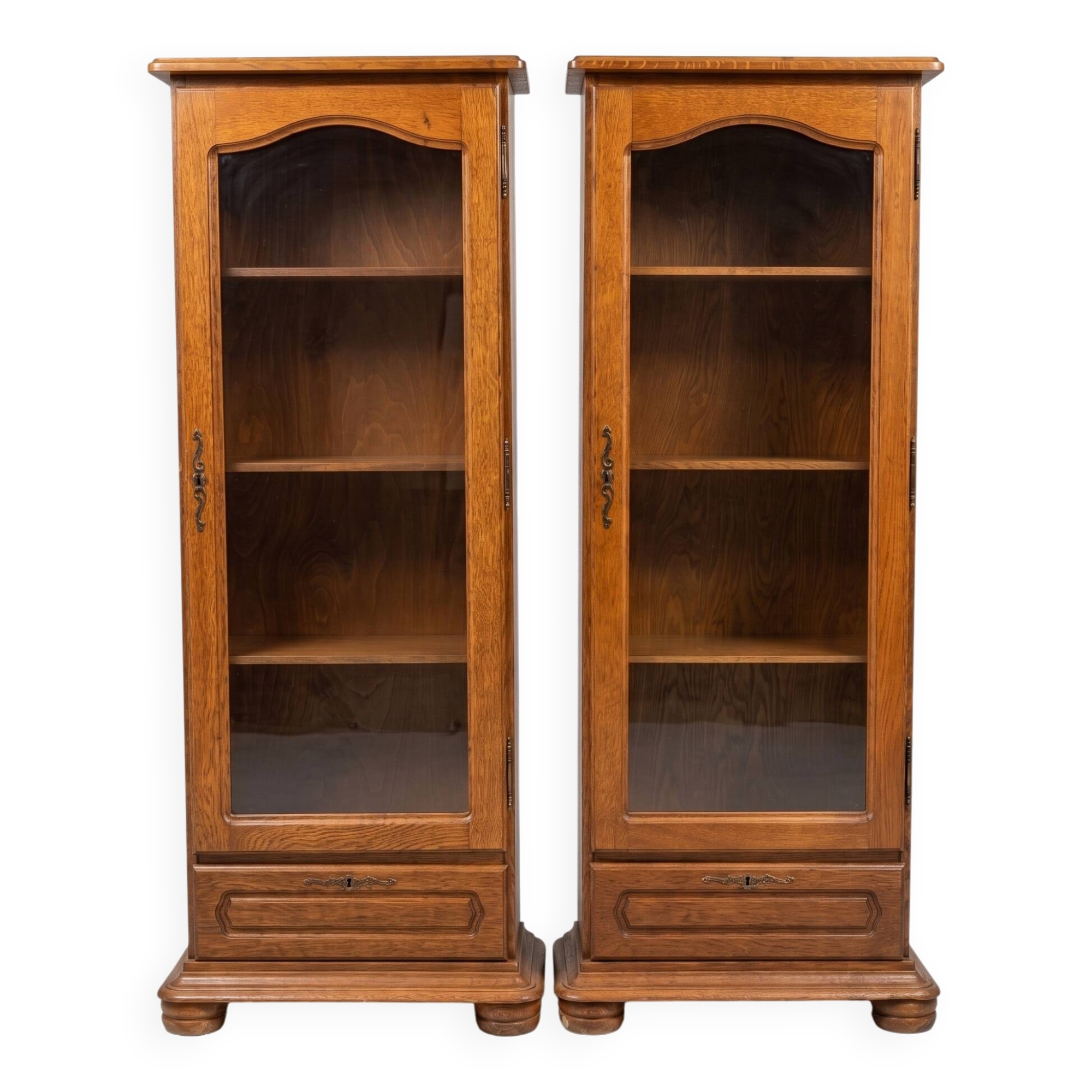 Set of 2 solid wood display cabinets with glass doors.
