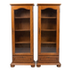 Set of 2 solid wood display cabinets with glass doors.