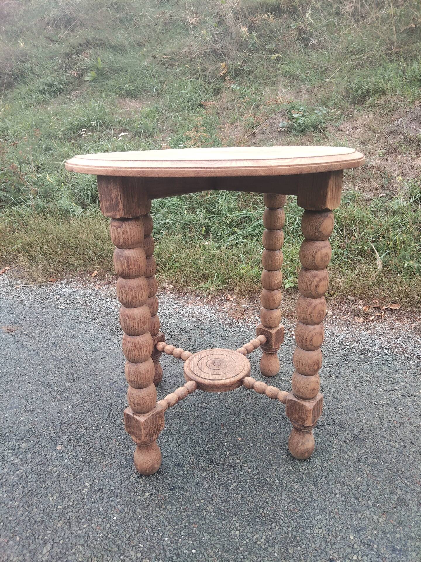 Oak gueridon in the style of Charles Dudouyt, 1940-50.