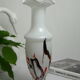 Corolla vase in white opaline with orange-brown patterns.