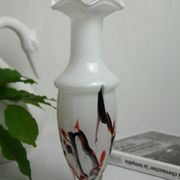 Corolla vase in white opaline with orange-brown patterns.
