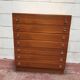 Brown teak Mid-Century chest of drawers with 7 drawers from the 1960s, sleek lines, discreet base.