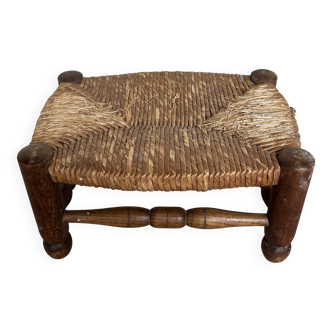 Rustic footrest made of wood and straw