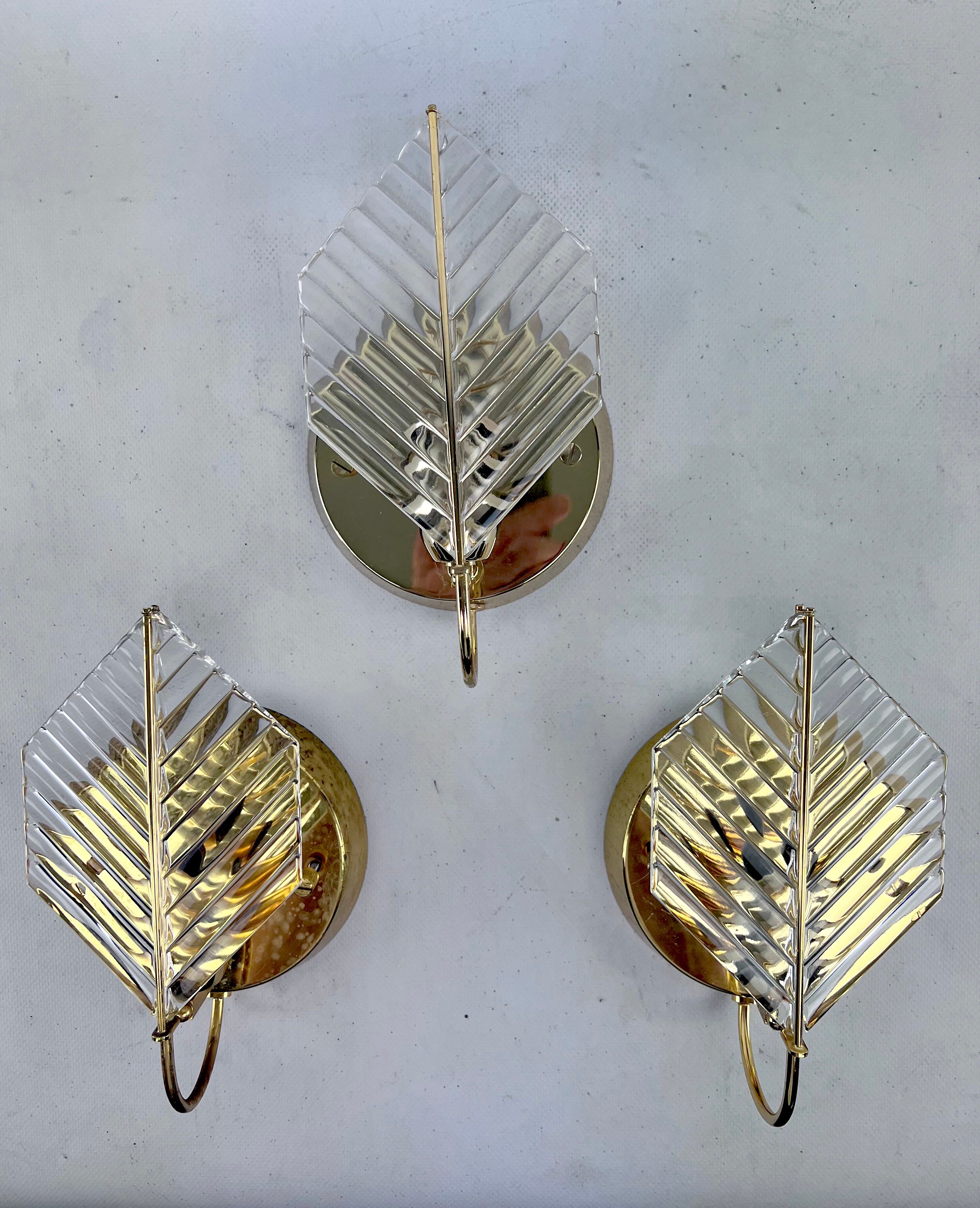 Vintage set of three sconces in brass and glass by Zero Quattro. Italy 1970s