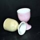 Set of 2 vintage pastel porcelain egg cups - yellow and iridescent pink
