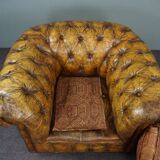 Patinated Chesterfield armchair