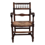 Renaissance-style armchair in solid wood, featuring a columned back