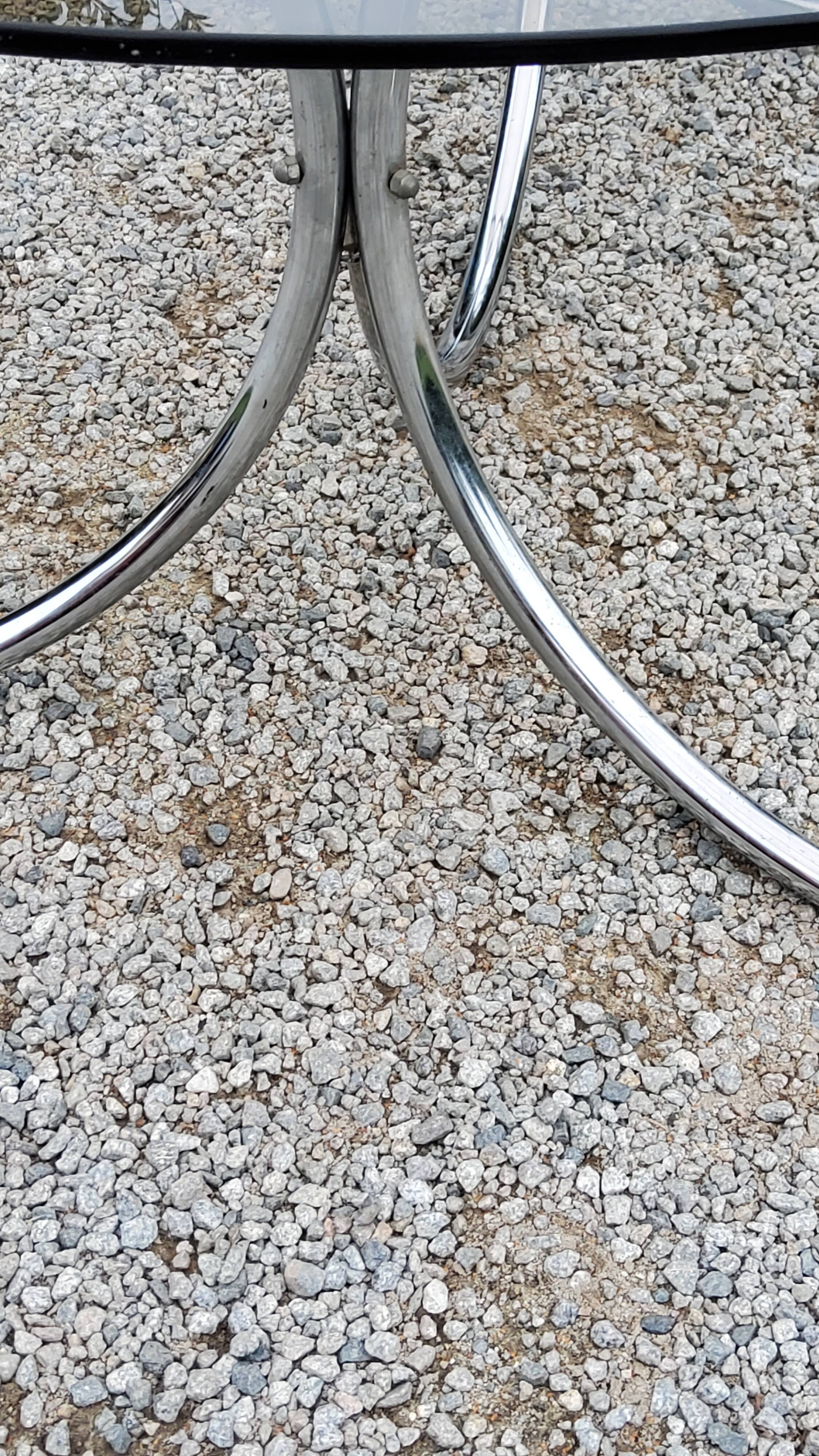 Dining table from the 70s top smoked glass base chrome