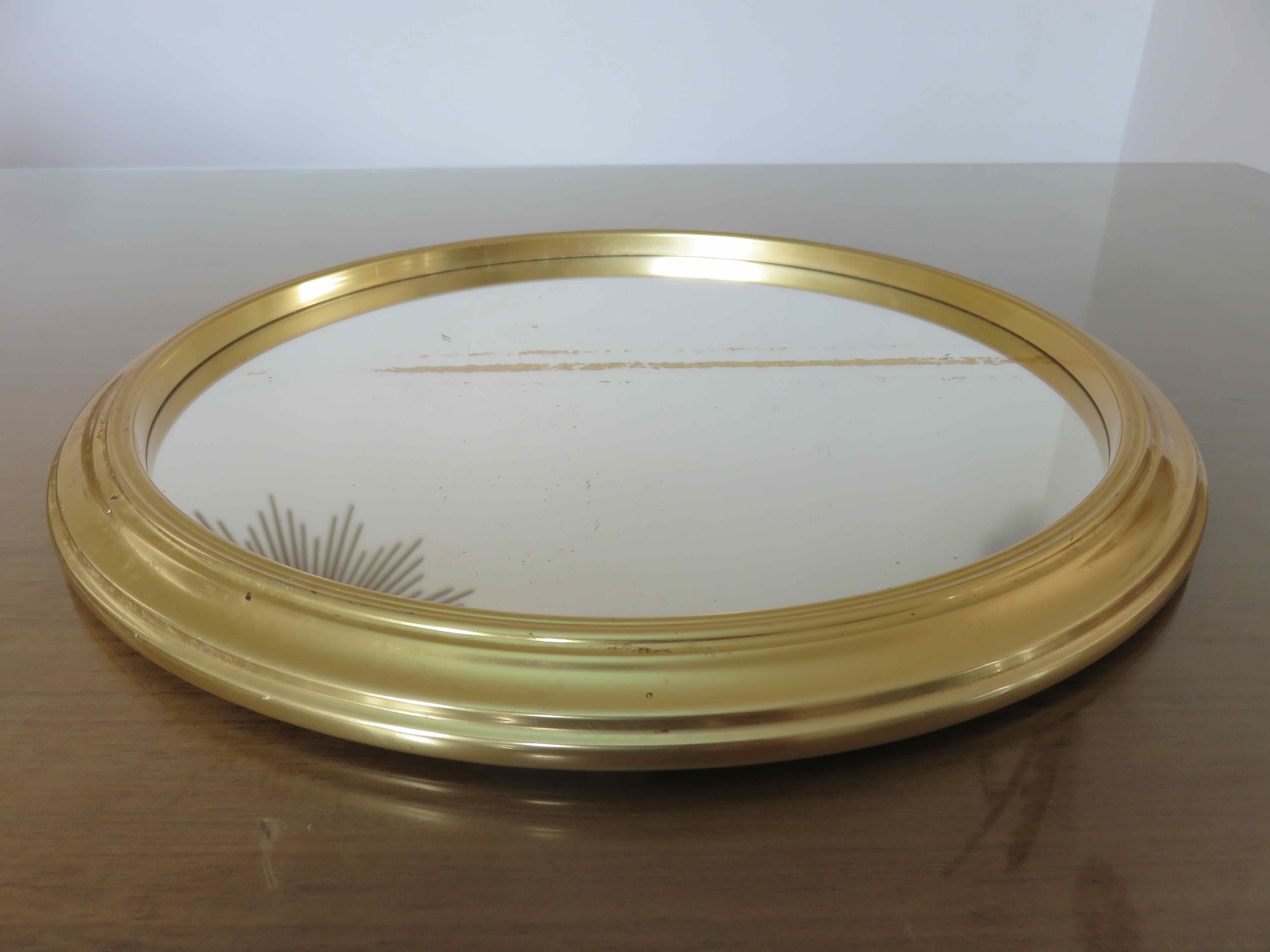 Round mirror top in gilded aluminum art deco