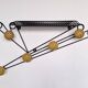 Black and yellow wall coat rack, France