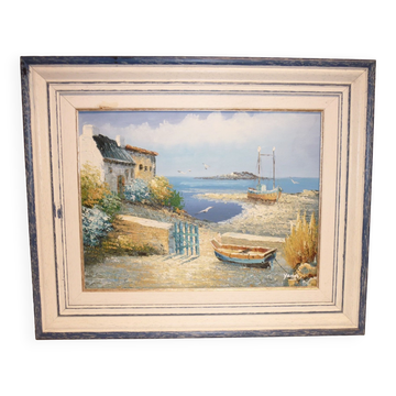 Oil on canvas of a boat on the foreshore signed Yann 55X45