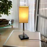 Silver floor lamp with a straight shade.