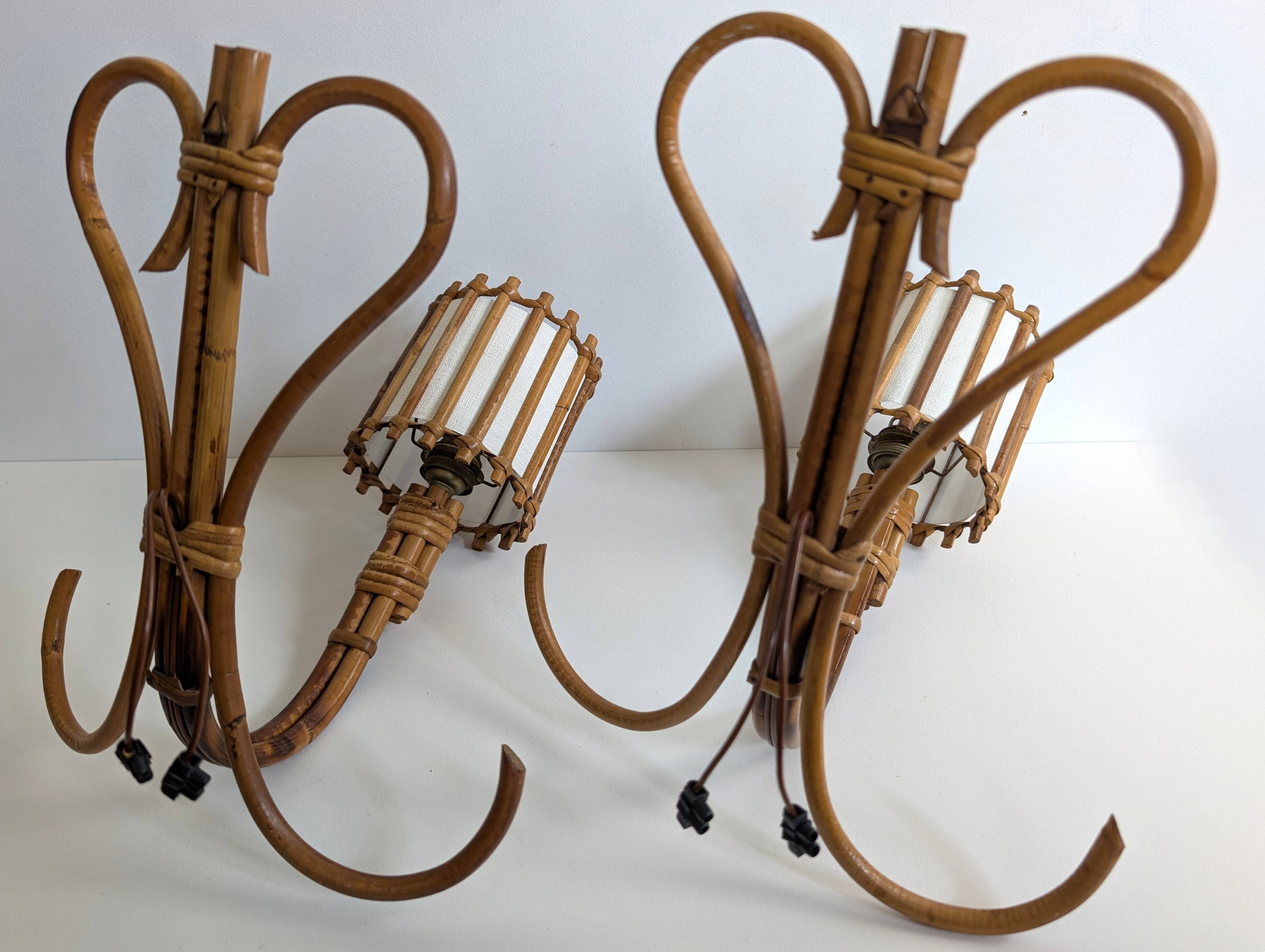 Rattan wall lights by Louis Sognot