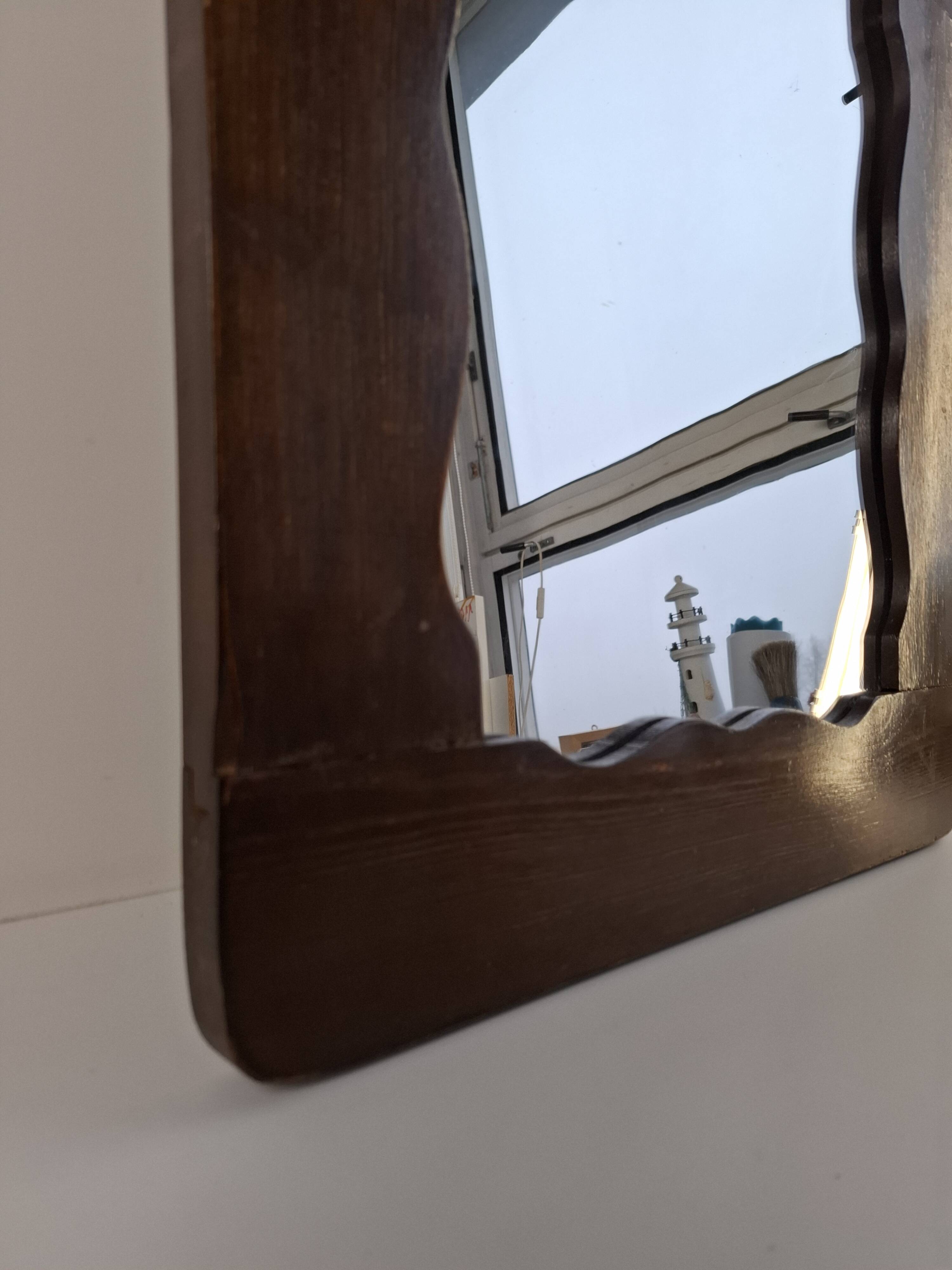 Czechoslovakian wall mirror with a wavy wooden frame, mid-century, 1940s