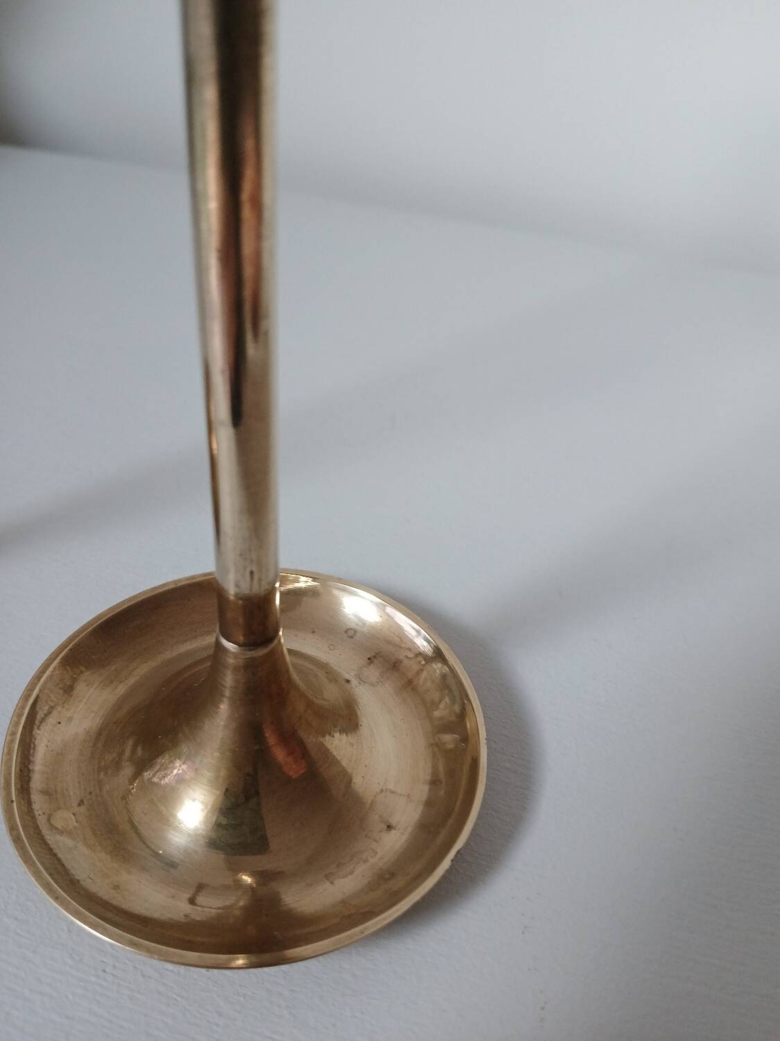 Set of two straight brass candlesticks.