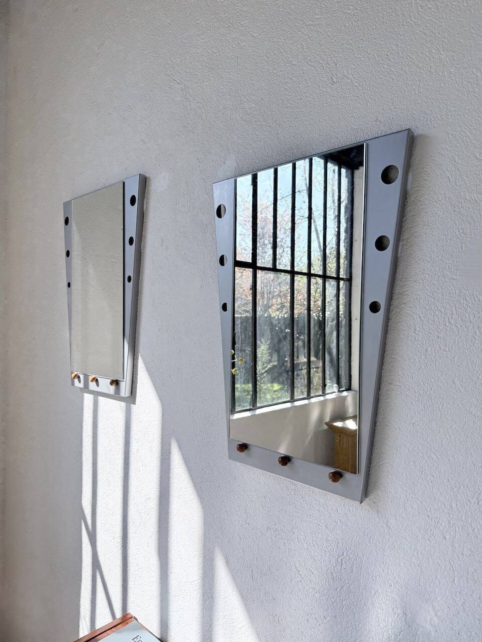 Pair of "Memphis" mirrors from the 80s in chrome and wood.
