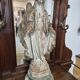 Garden statue of the Virgin Mary in old reconstituted stone