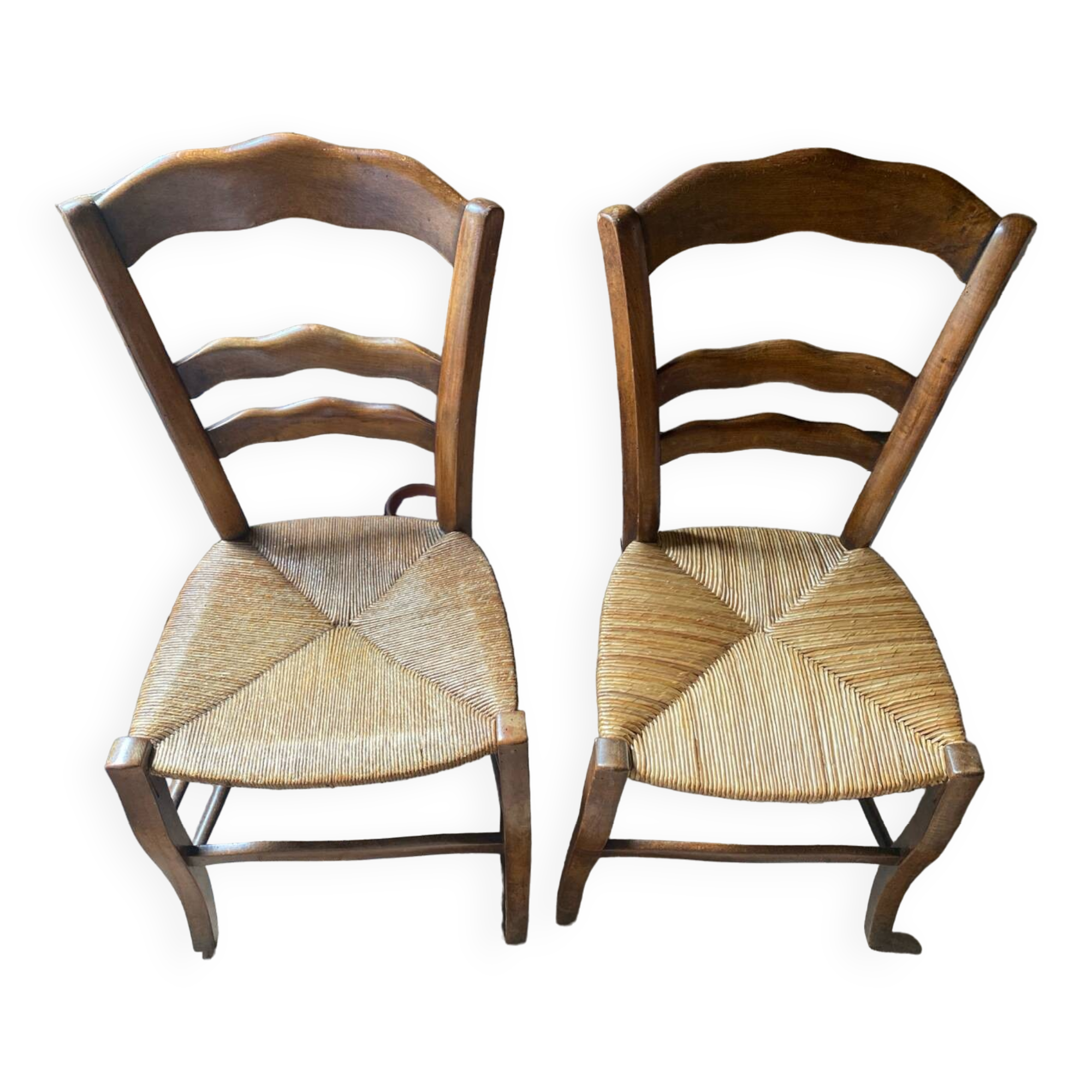 2 wooden chairs with cane