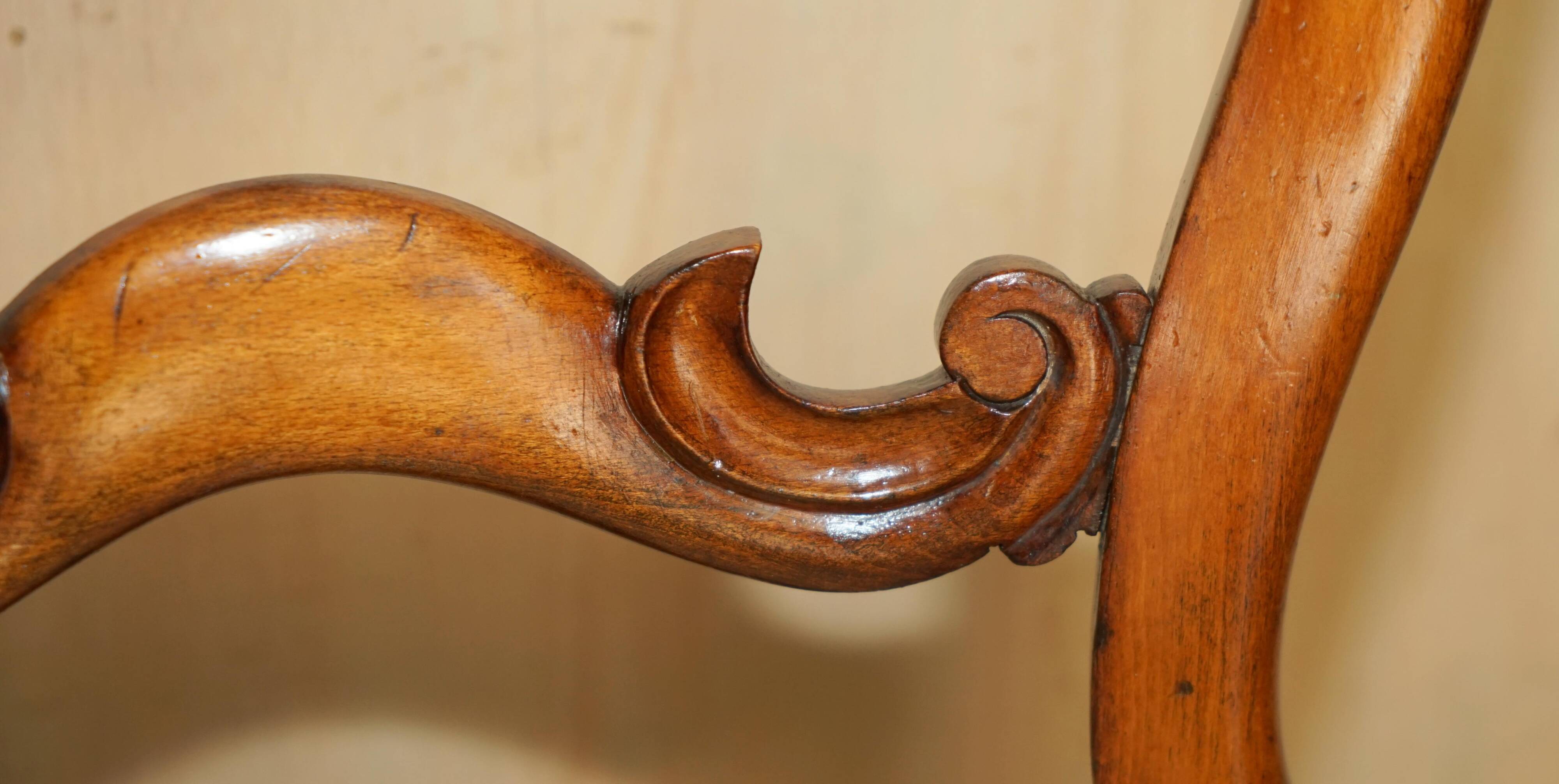 Victorian walnut dressing table chair from around 1880 with a medallion on the backrest.