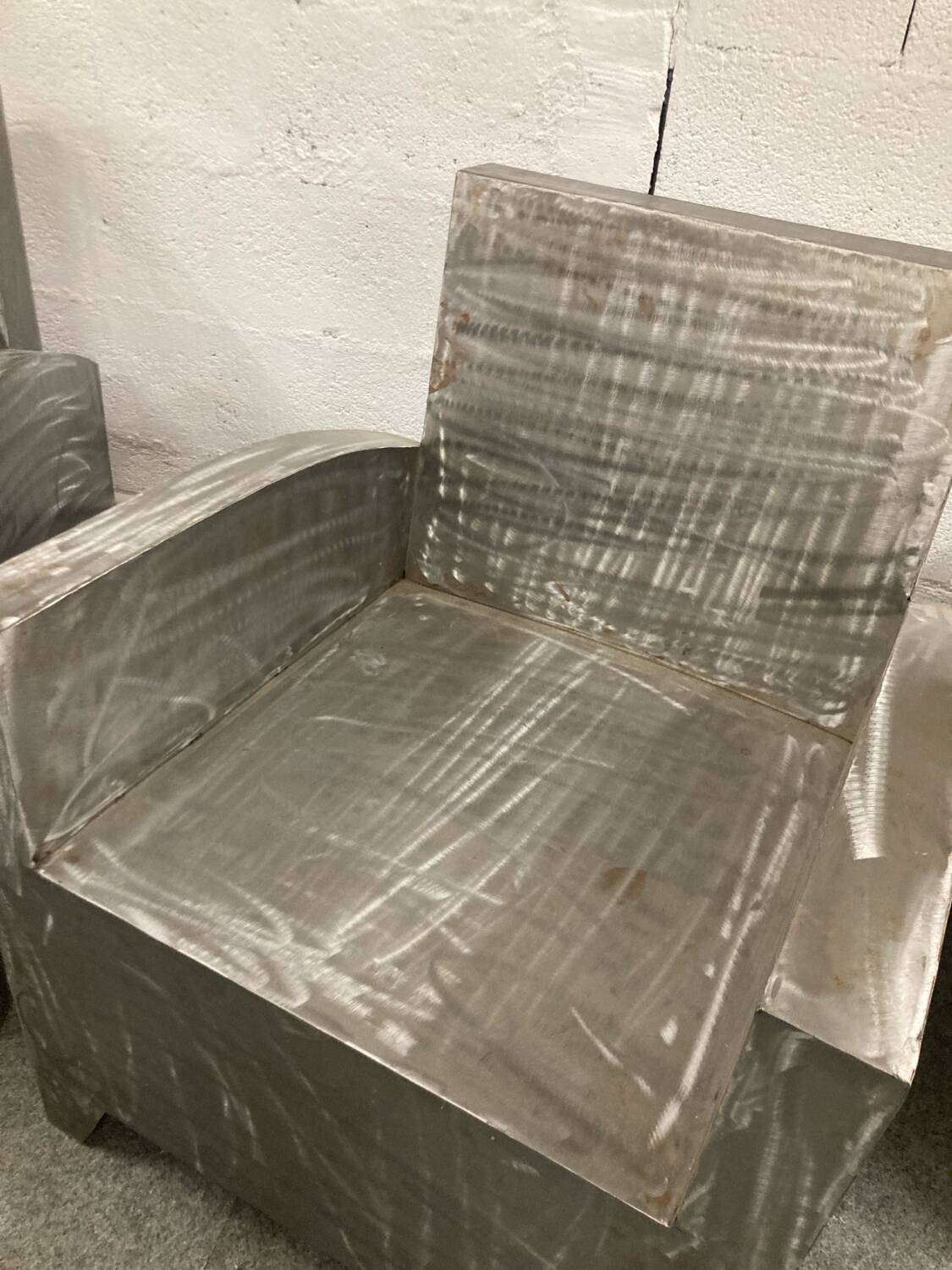 Pair of industrial metal armchairs