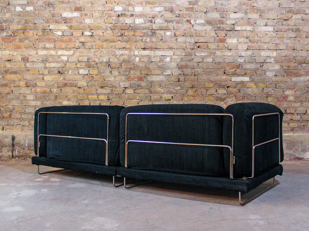 Black fabric design sofa with chromed steel frame